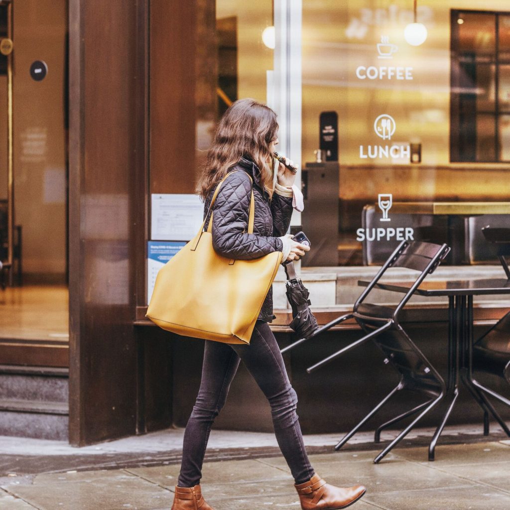 woman carrying a stylish tote bag for everyday use in the city