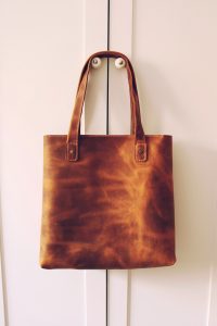 "Structured leather tote bag on a neutral background"
