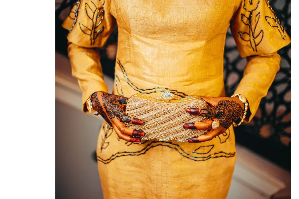 gold metallic clutch bag with cocktail dress.stylo
